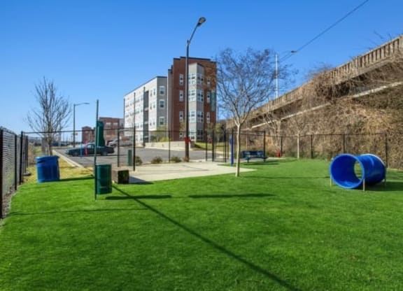 a playground in a park with a building in the background at Smith and Porter, Atlanta, 30313