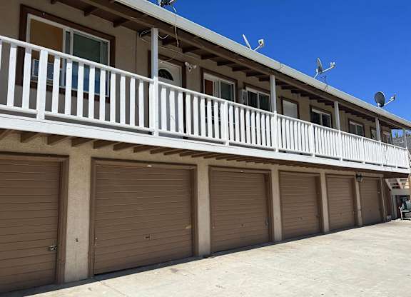 a row of garage doors on the side of a building