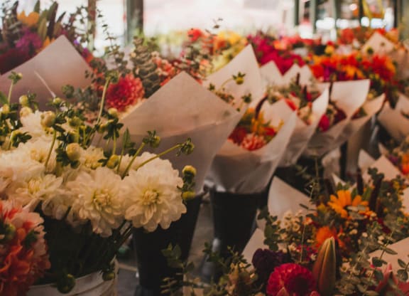 a bunch of bouquets of flowers in a flower shop