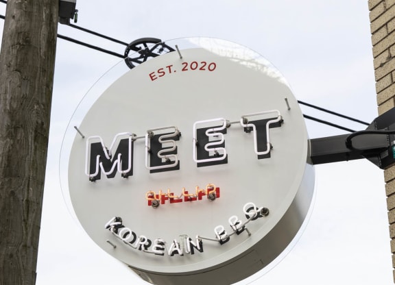 a sign for a restaurant on the side of a building