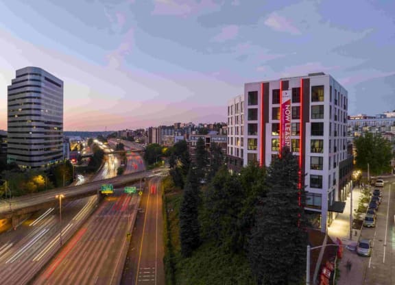 a view of the city from a high rise building at dusk