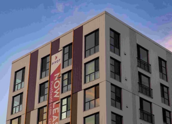 a rendering of a building with a banner on the side of it