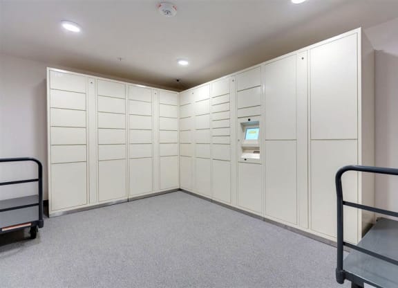a large closet with white cabinets and a bunk bed