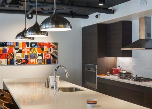a kitchen with a counter top and a sink