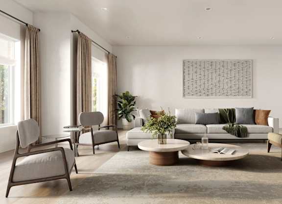 A living room with a grey sofa, a coffee table, and a large artwork on the wall.