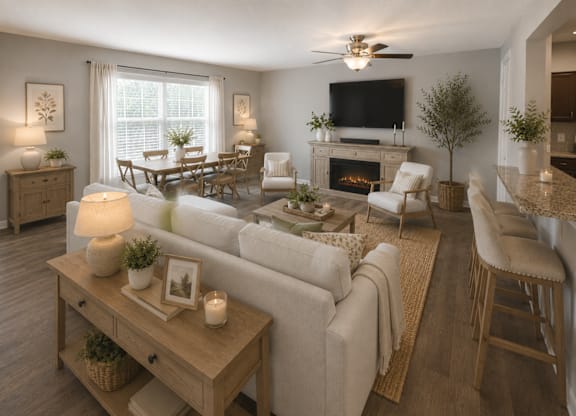 A living room with a fireplace and a television.