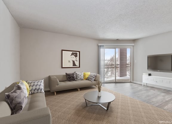 a living room with a couch and a table and a tv  at Eastwood Crossings, Kansas City