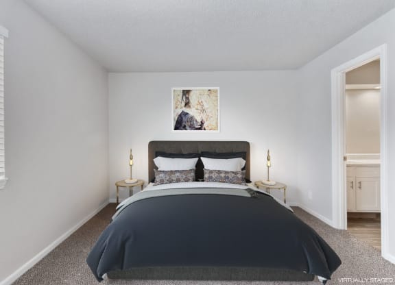 a bedroom with a bed and a window  at Eastwood Crossings, Kansas City, Missouri
