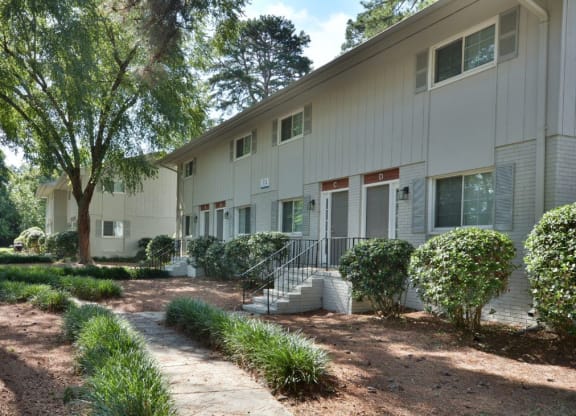 the exterior of a building with stairs and a sidewalk at Parkside at Five Points Apartments, Raleigh , NC