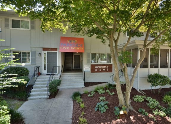 the front of a building with steps and a sidewalk at Parkside at Five Points Apartments, Raleigh