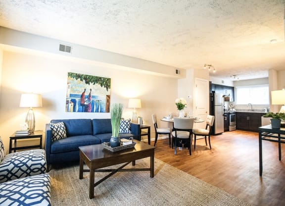 a living room with a couch and a coffee table at Parkside at Five Points Apartments, North Carolina, 27608