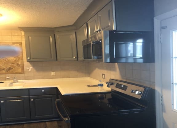 Kitchen With Black Appliances at Timberstone, Charlotte
