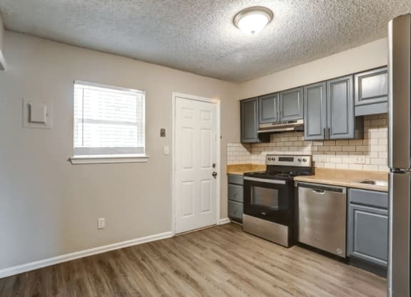Kitchen and living room with lights at Greenwood Village, Charlotte