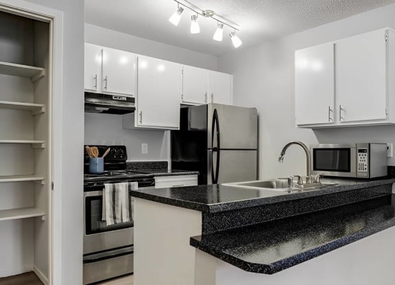 Kitchen With Black Appliances at Aspen Landing, Missouri