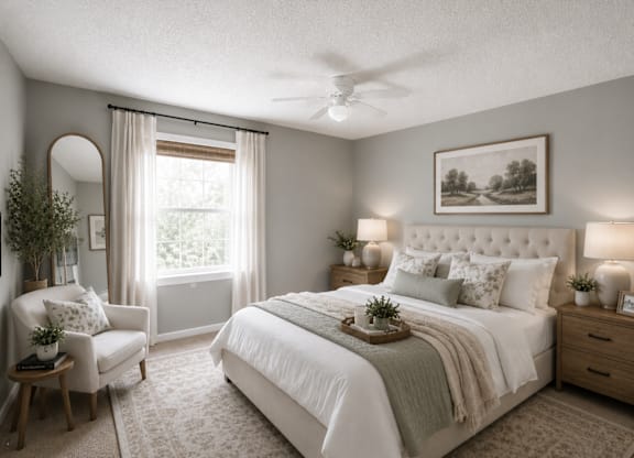 A bedroom with a large bed, a chair, and a painting on the wall.