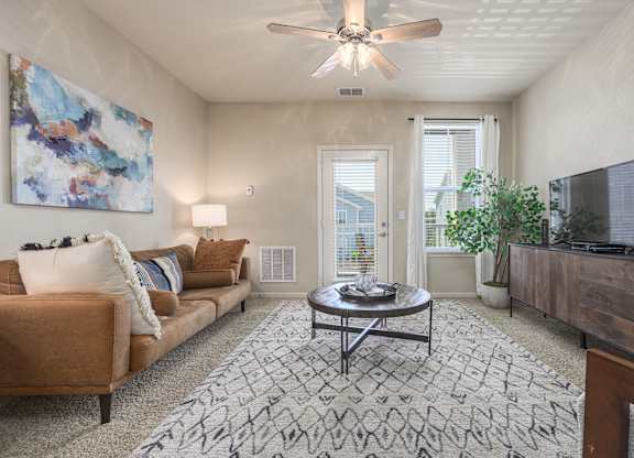 Living Room With Private Balcony at Spring Creek Apartments, Crestview, 32536