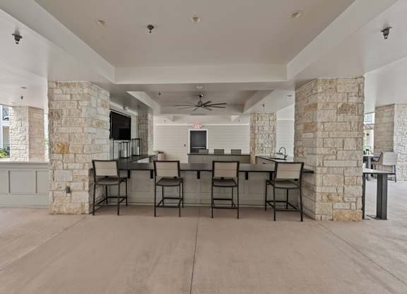 A Spacious Room with a Stone Wall at Citadel at Westpointe Apartments, Texas