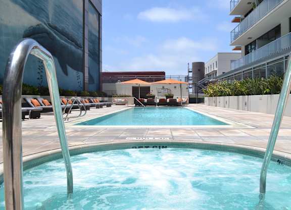A swimming pool with a slide in the middle.
