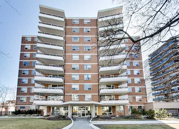 A large apartment building with a lot of windows and balconies.