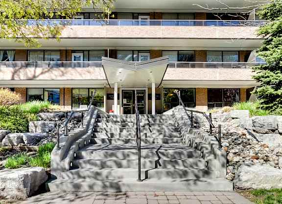 a building with a set of stairs and a fountain