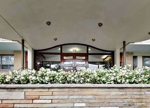 The entrance to a building with a sign that reads