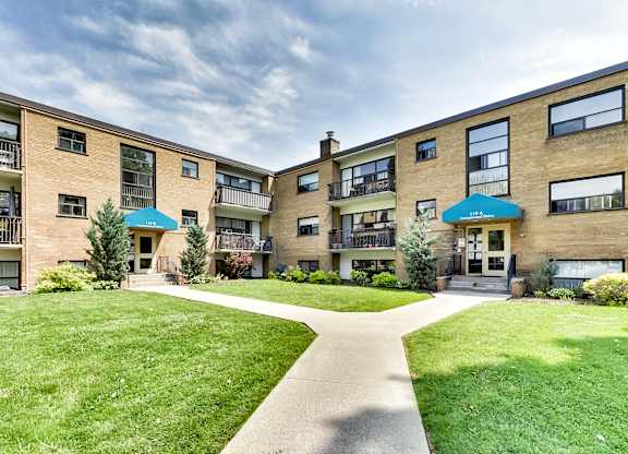 A sunny day at a residential complex with a clear blue sky.