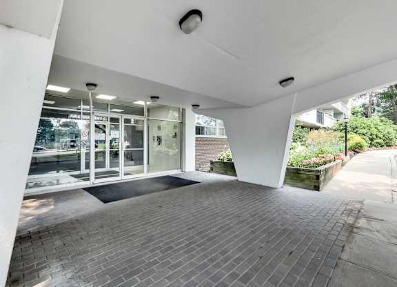 a view of the front entrance of a building with glass doors