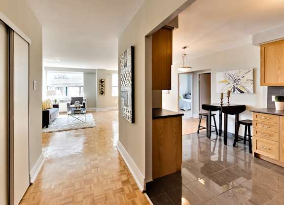 a view from the living room into the kitchen and dining room of a house