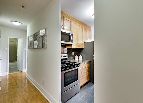 a view of a kitchen with a stove and a microwave