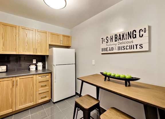 A kitchen with a sign that says