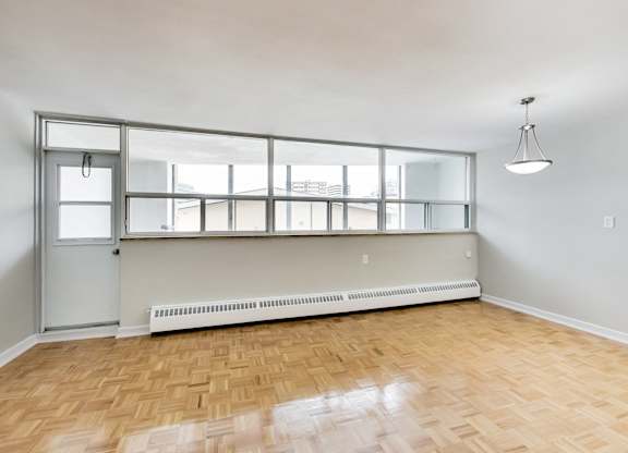an overhead view of a room with white walls and wood flooring