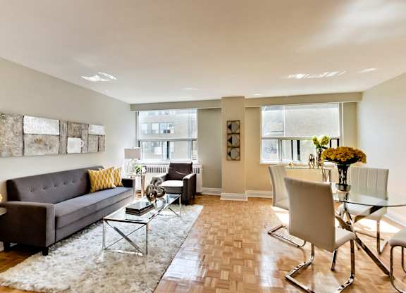 a living room and dining room with a couch and a table
