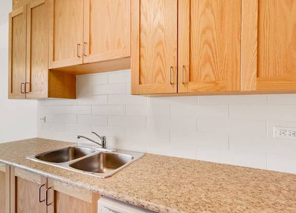 a kitchen with a stove and a sink