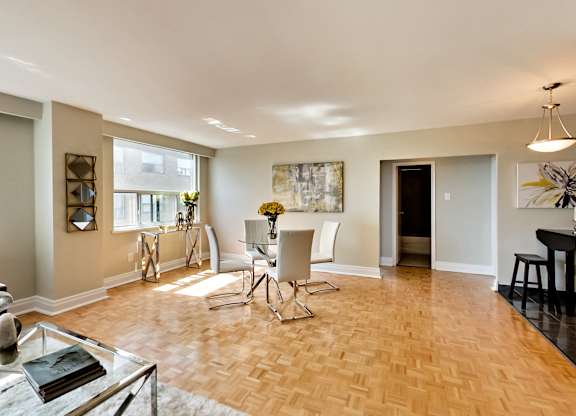 an open living room and dining room with a table and chairs
