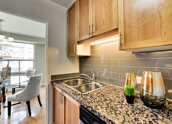 a kitchen with granite counter tops and a sink