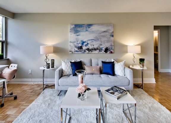 an apartment living room with a couch and tables
