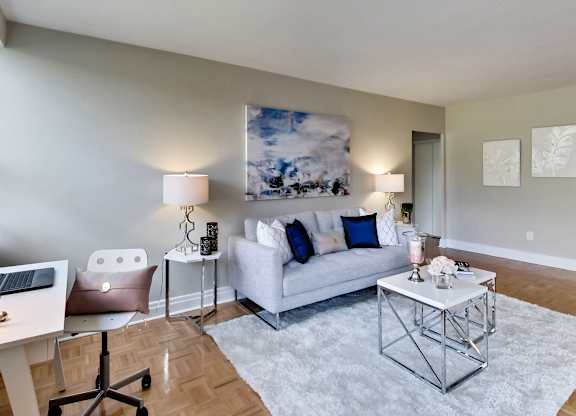 an open living room with a couch and a table