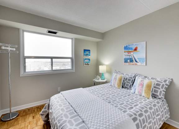 a bedroom with a large bed and a window