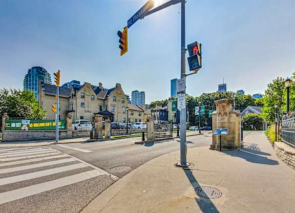 a street corner with a traffic light and some buildings