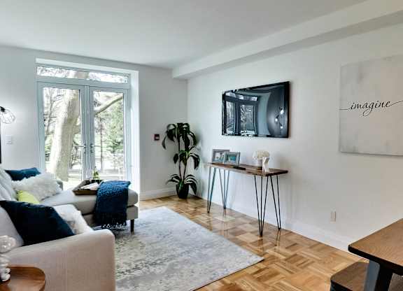 a living room with a couch and a tv