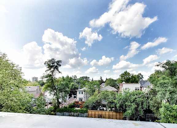 the view from the roof of a neighborhood with houses and trees