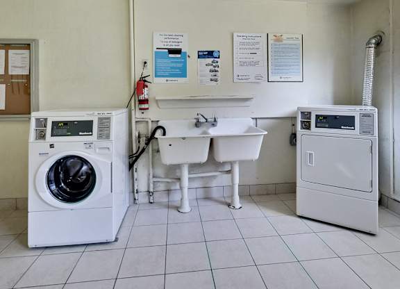 a washing machine and a sink in a laundry room with a washer and sink