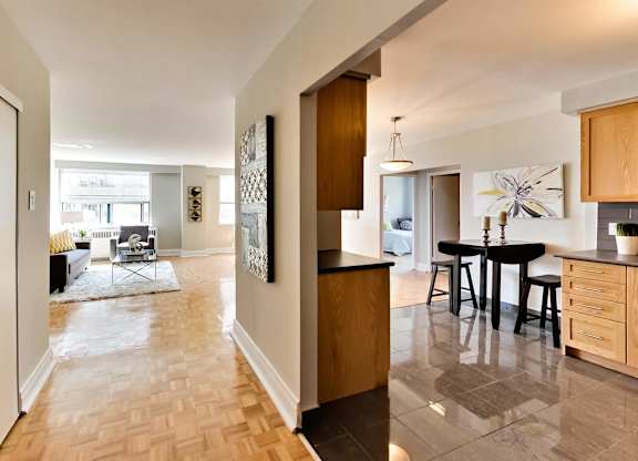 a view of a living room and dining room from the kitchen of a house