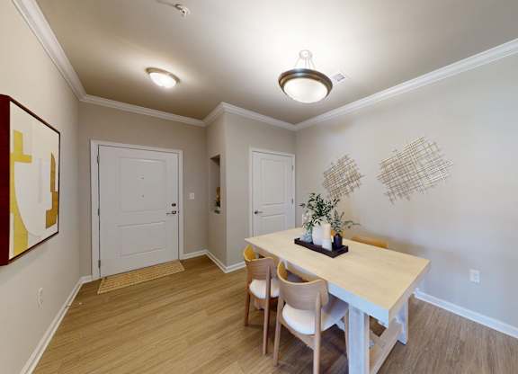 a separate dining space with a chandelier