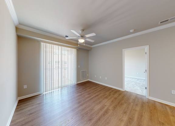 a spacious living room with luxury vinyl flooring