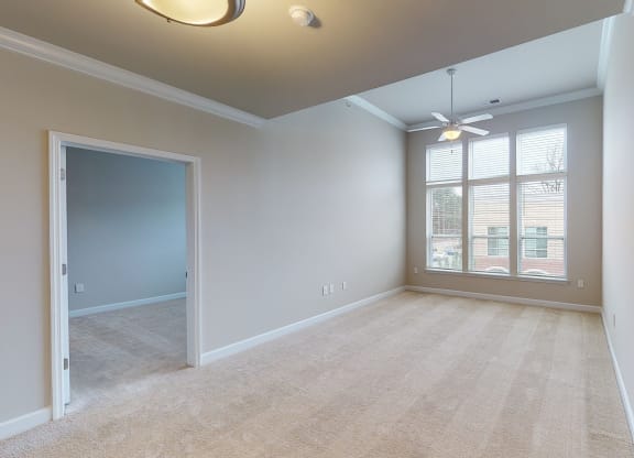 Living room and sunroom with ceiling fan