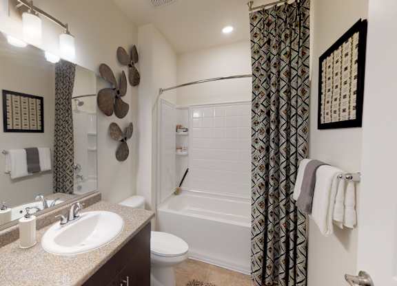Bathroom with sink, toilet, shower and tub