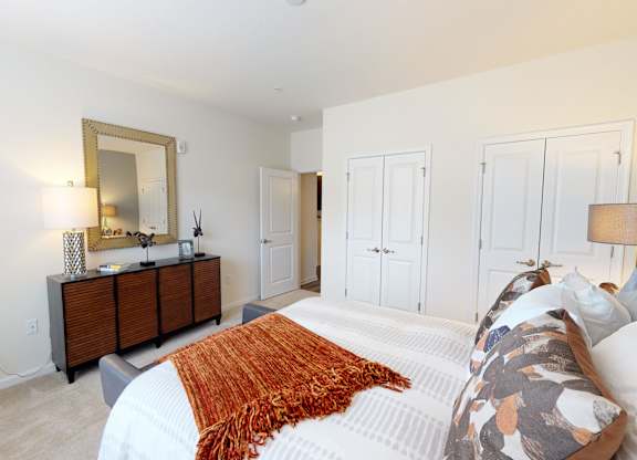 Bedroom with closet and carpet; hallway bathroom