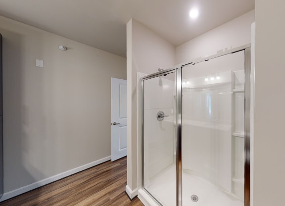 Bathroom with shower and vinyl floors