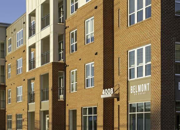 Exterior of four-story building with retail space available on the first floor
